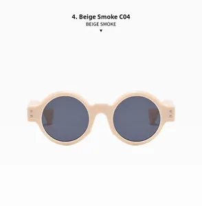Detail of beige round punk sunglasses with smoke grey lenses and silver double rivets