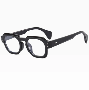 Detail of glossy black irregular polygon sunglasses with decorative silver rivets