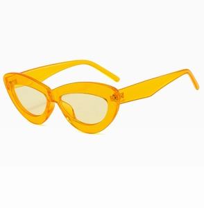Detail view of orange transparent cat-eye sunglasses in a stylish retro resin frame