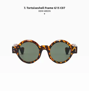 Detail of round punk sunglasses with demi frame and G15 green lenses on white background