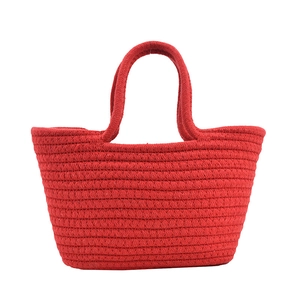 Red cotton rope woven tote bag with dual handles and summer beach style texture