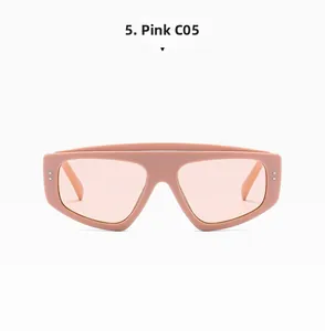 Detail view of pink flat top cat eye sunglasses with silver rivets on translucent frame