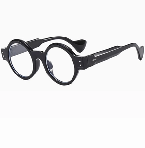 Detail view of round punk sunglasses with thick black frame and silver rivet accents