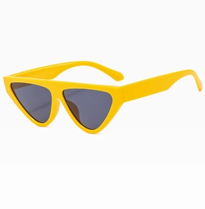 Detail view of yellow cat-eye sunglasses with dark triangular lenses and sleek frame