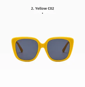 Detail view of stylish square yellow frames with dark grey lenses in color C02