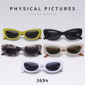Détail de lunettes de soleil œil de chat stylées en cinq couleurs, dont écaille et jaune