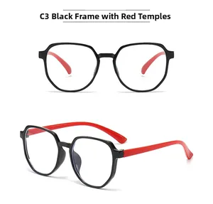 Detail view of kids blue light glasses with black frames and red temples in C3 color style