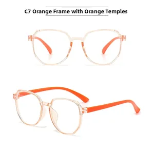 Detail view of children's blue light blocking glasses with orange frames and temples