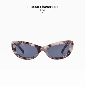 Détail de lunettes de soleil œil de chat avec monture écaille vintage et verres foncés