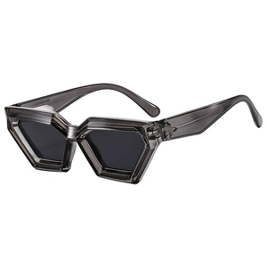 Polygonal geometric sunglasses with smoky grey translucent frames and dark grey lenses
