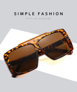 Detail of square oversized tortoiseshell sunglasses with brown gradient lenses and studs