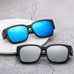 Detail view of polarized oversized sunglasses with blue and silver mirrored lenses