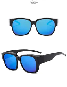 Close-up of oversized square sunglasses with black frame and blue mirrored lenses
