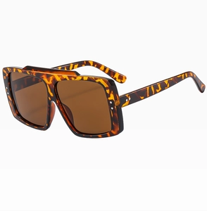 Detailed 45-degree angle of tortoiseshell square sunglasses with brown lenses
