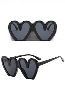 Detail view of heart-shaped sunglasses in black and gray from multiple angles