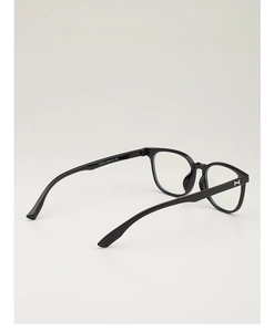 Macro detail of black retro glasses frame showing temple hinge and specification text