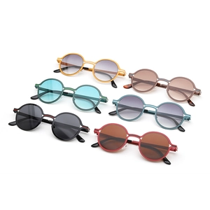 Detail shot of vintage round metal sunglasses in six assorted frame and lens colors