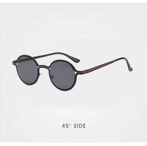 Detail view of round retro sunglasses with black frames and red stripe accents on the temples
