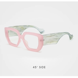 Detailed 45-degree side view of pink oversized glasses frames with marble texture temples