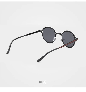 Detailed side view of round sunglasses featuring signature green and red stripe on the temple