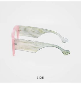 Side view of trendy wide-temple glasses with pink frame and green marble texture details