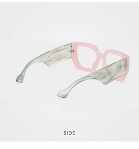 Side view of trendy pink translucent frame glasses with wide marble pattern temples