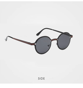 Side view of round two-tone metal sunglasses with black matte frame and red accents
