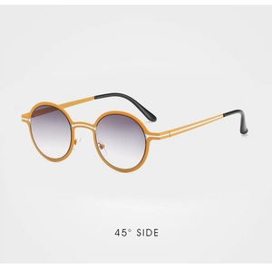 Detail view of round sunglasses with orange frames and gradient purple lenses at 45 degree
