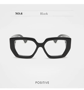 Front view of black geometric hexagonal chunky frame glasses with clear lenses