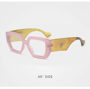Detail view of pink transparent frames with yellow tortoiseshell pattern wide temples
