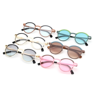 Vintage round metal sunglasses in various colors with retro frames and UV protection