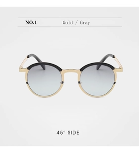 45-degree side view of vintage round metal sunglasses with gold frames and gray lenses