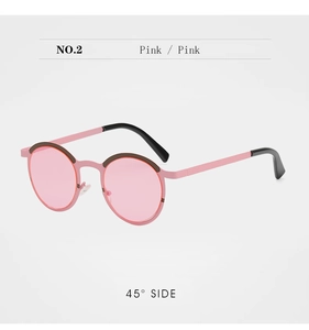 Detail of round pink metal sunglasses with tinted lenses from a 45-degree angle view
