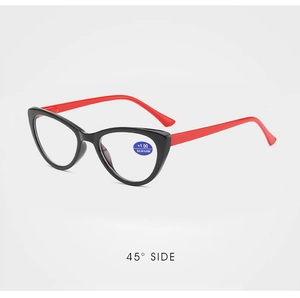 Detail view of cat-eye reading glasses with red temples and blue light block lens