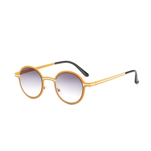 Retro orange round frame sunglasses with gradient grey lenses and metallic accents