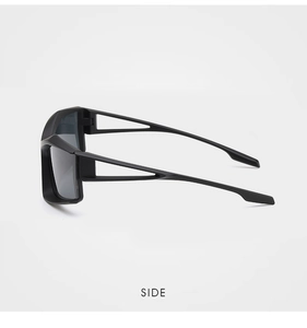 Side view of matte black avant-garde sunglasses with unique hollow temple design details