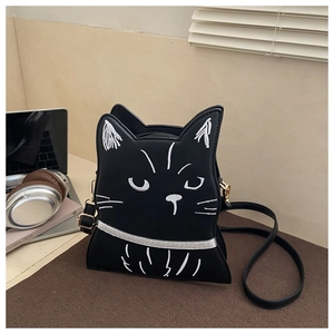 Detail of cute black cat crossbody bag with white embroidery and silver collar accents