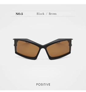 Close-up of futuristic geometric butterfly sunglasses with thick black frames and brown lenses