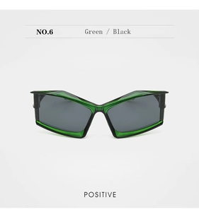 Detail view of futuristic green butterfly sunglasses with dark lenses from the front