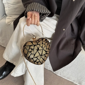 Elegant heart-shaped evening clutch bag with gold sequins and metallic top handle