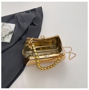 Golden acrylic evening clutch bag with metallic beads handle and cross-body chain