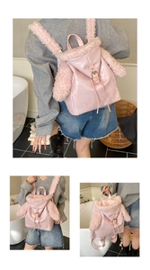 Detailed view of pink plush rabbit backpack featuring PU leather trim and metal buckles