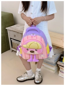 Detail of pink and purple kids backpack with cute cartoon bear and soft plush feet