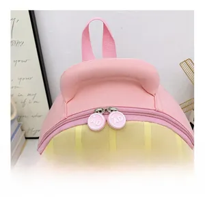 Detail view of pink and yellow backpack featuring a smooth rubber zipper head with AD logo
