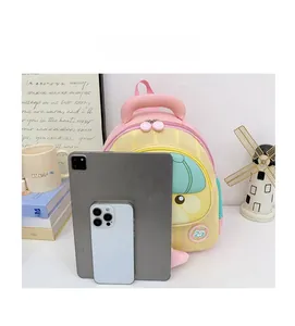 Detailed size comparison of macaron contrast schoolbag next to a tablet and a smartphone