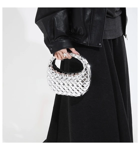 Close-up of silver woven hobo bag showing metallic texture and hand-braided detail