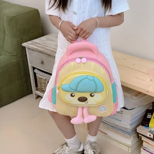Toddler macaron color-block backpack with cartoon bear and plush legs on yellow background