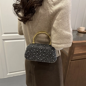 Elegant black rhinestone evening clutch with gold bamboo handle and chain strap