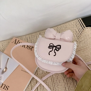 Pink girls crossbody bag with large bow and lace details for stylish kids