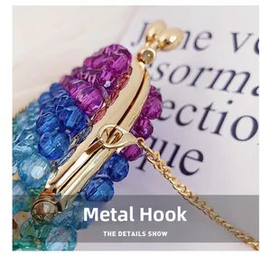 Close-up of blue and purple acrylic beaded bag with a sturdy golden metal hook and clasp